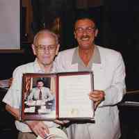 Color photo of Mayor Anthony Russo handing Mayoral Proclamation to George Kirchgessner, Hoboken City Hall, June 27, 1997.