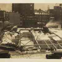 Sepia-tone photo of progress in foundation construction on the north end of the site for the Fabian Theatre, Hoboken, Jan 30, 1928.