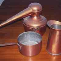          photo 1: S. Fisher & Co. copper candy making utensils: pitcher, pot, retort
   