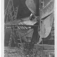 B+W photo of repair on the steerage of an unknown ship in dry dock, Hoboken, no date, ca 1940.