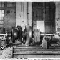 B+W photo of low pressure turbine rotor of the S.S. Bonheur on a lathe, machine shop, Hoboken, Jan., 1938.