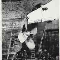 B+W photo of MV Grand Justice, stern view, in dry dock at Bethlehem Steel Shipyard, Hoboken, n.d., early Feb. 1975.