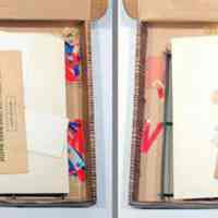          box open with layers of materials as found
   