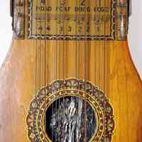          detail top: quarter below center with bottom sound hole
   