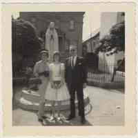          photo 1: Thomas & Elsie Kelly with daughter Irene, outside St. Ann's, 1962
   