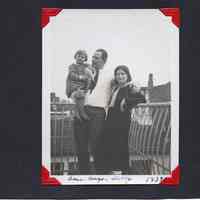          44: family posed on balcony or roof: Aase, Hugo(?), Nelly(?) 1932.
   