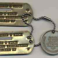          dog (mililtary identification) tags with numbers masked
   