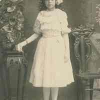 Sepia-tone photo of "Genevieve K." posed in a studio, Hoboken, no date, ca. 1900-1910.