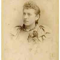 Cabinet photo of young woman posed in photographer