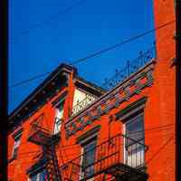          Color slide of detail view of cornice, fire escape and façade of buildings on 10th between Washington and Bloomfield picture number 1
   