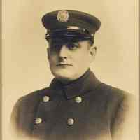 Sepia-tone photo of an unidentified Hoboken Fire Dept. member in dress uniform, Hoboken, n.d., ca. 1910-1920.