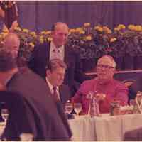 Color photo of Mayor Steve Cappiello with President Ronald Reagan et al at a dinner at Saint Ann