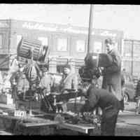 Color slide of a camera set-up with some cast and crew on pier set of the motion picture "On the Waterfront", Hoboken, n.d., ca. late 1953-early 1954.