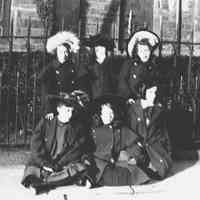 B+W negative image of 6 woman in winter dress, no place, no date, ca. 1900-1910.