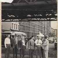 B+W photo of men under streetcar elevated structure on Observer Highway at Washington St., Hoboken, circa 1947-1950.