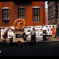 Color slide of a pretzel cart.