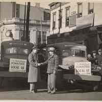 B+W photo of John J. Grogan (left) with two army ambulances donated by Local 15 Shipyard Workers, CIO, Hoboken, ca. Jan. - Feb. 1944.