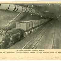 Digital image of postcard titled: Bringing out the excavated matter, The Hudson & Manhattan Railroad Co. Tunnel (McAdoo system), 1908.