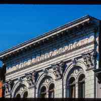          Color slide of close-up view of cornices, dentils, pilasters, arched windows and frieze reading 