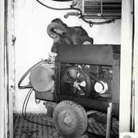 B+W photo of low temperature start-up test inside artic chamber of portable air compressor at United States Testing Co., Hoboken. N.d., ca. 1970s or 1980s.