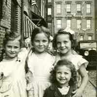 B+W photo of 4 girls posing on Willow Terrace North, Hoboken, no date, ca. 1940-1945.