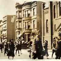 Digital image of sepia-tone photo of a Hudson Street parade with soldiers and a woman marching, Hoboken, no date, ca. 1920-25.