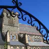          12: view of east facade from Willow Ave. with iron fence archway
   