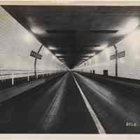 B+W photo inside north tube of Holland Tunnel at state line markers, NY; photo HT-8028; taken 1928, issued 1932 or later.