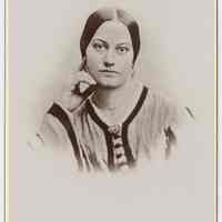 Cabinet photo of a young woman posed in photographer