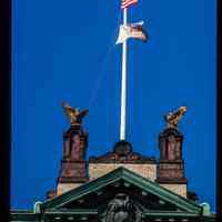          Color slide of detail view of flagpole, eagle ornaments, cornice, pediment, and frieze on Hoboken City Hall, 94 Washington between Newark & 1st picture number 1
   