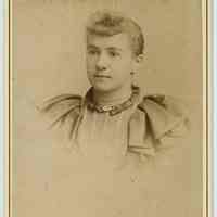 Cabinet photo of young woman posed in photographer