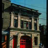          Color slide of eye-level view of the Hoboken Fire Department Engine Company No. 6 fire station façade and frieze reading 