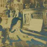 Sepia-tone photos, 2, of Florence Miller at piano, 716 Bloomfield St., Hoboken, n.d., ca. 1898-1905.