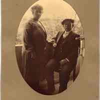 Digital image of sepia-tone photo of Carl and Lisbet Toepfer posed on balcony or porch, no place, no date, circa 1900.