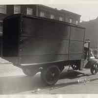 Sepia-tone photo of a truck parked on a Hoboken street, Hoboken, Jan. 25, 1930.