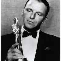 B+W reproduction photo of Frank Sinatra holding his Oscar statuette (Academy Award) for Best Supporting Actor, Hollywood, CA, March 25, 1954.