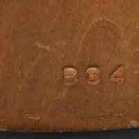          detail back bottom: blind stamped numbers
   