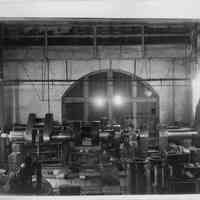 B+W photo of a crank shaft on large lathe with 3 machinists, machine shop, Hoboken, no date, ca. 1935-1940.