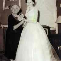 Sepia-tone photo of Joan Smith Cunning in wedding dress with grandmother Olinda (Tostain) Roarty, Hoboken, 1955.