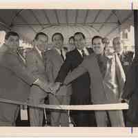 B+W photo of a ribbon cutting at K of C housing, Bloomfield St., Hoboken, n.d, ca. 1983-1988.