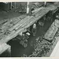 B+W photo documenting pier damage at the Bethlehem Steel Shipyard, Hoboken Division, no date (pre-1957)