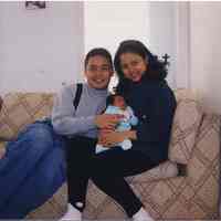 Color photo of Syahreza Yusuf and Ayu Wulansari with their son, Ayureza Kenusa Yusuf, Hoboken, no date, ca. Spring, 1999.