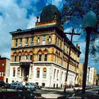 Color photo of the exterior of the Hoboken Public Library taken from Church Square Park, Hoboken, no date, ca. 1975.