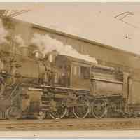 Sepia-tone photo of D.L. & W. R.R. steam locomotive no. 1033 at Hoboken, Jan. 30, 1937.