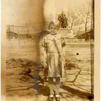 Sepia-toned photo of a young girl taken in Elysian Park, Hoboken, no date, ca. 1924-1926.
