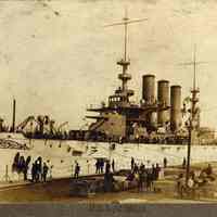 Sepia tone photo of the U.S.S. Georgia berthed at Bath Iron Works, Bath, Maine, May 14, 1906.