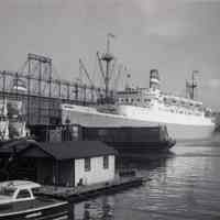 B+W photo of floating shack at 4th St. & Hudson River; Holland America Line 5th Street Pier; S.S. Ryndam, Hoboken, n.d., ca. 1951-1963.