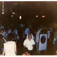 Color photo of supporters of mayoral candidate Tom Vezzetti in front of City Hall on election night, Hoboken, [June 11, 1985].