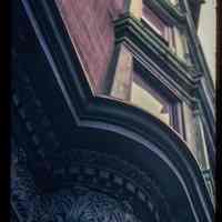 Color slide of detail view of cornice and bay windows at 217 10th on the SE corner of 10th and Park