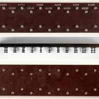          accessory: unknown use; views of top, edge and bottom
   
